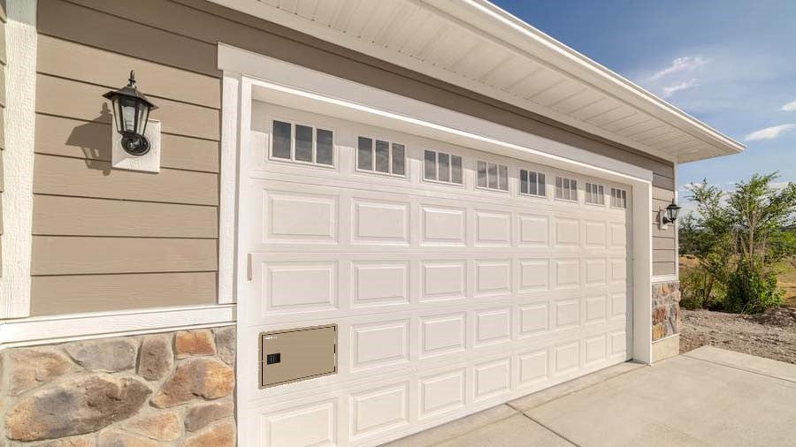 White garage door with beige SafeDrop delivery door installed